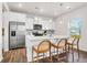 Stylish kitchen featuring white cabinetry, stainless steel appliances, a center island, and modern pendant lighting at 1017 Marsh Harrier Dr # Cc3-3-3, Ravenel, SC 29470