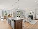 Bright and spacious kitchen open to the living room, featuring an island and stainless steel appliances at 1018 House Finch Ave # Cc3-22-8, Ravenel, SC 29470