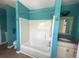 Bathroom featuring a shower-tub combo, blue walls, and vanity with sink at 1026 Stono River Dr, Charleston, SC 29412