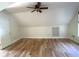Attic bedroom featuring hardwood floors, ceiling fan, and white walls at 1026 Stono River Dr, Charleston, SC 29412