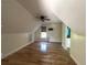 Attic bedroom featuring hardwood floors, a ceiling fan, and a window at 1026 Stono River Dr, Charleston, SC 29412