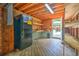 Outbuilding with wooden floors, refrigerator, and work bench at 1026 Stono River Dr, Charleston, SC 29412