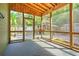 Relaxing screened porch with vaulted wood ceilings, overlooking a gazebo and fenced yard at 1026 Stono River Dr, Charleston, SC 29412