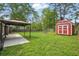 Fenced backyard with gazebo, storage shed, and mature shade trees at 106 Ruffin Rd, Summerville, SC 29486