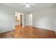 Bedroom view with ceiling fan, closet, doorway to bathroom, and wood-look floors at 106 Ruffin Rd, Summerville, SC 29486