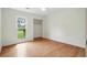 Sun-filled bedroom offers wood-look flooring, a closet, and a large window at 106 Ruffin Rd, Summerville, SC 29486