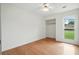 Bright bedroom features wood-look floors, closet, ceiling fan, and sunlit window views at 106 Ruffin Rd, Summerville, SC 29486