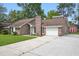 Beautiful brick home features a well-maintained lawn, garage, and driveway, offering great curb appeal at 106 Ruffin Rd, Summerville, SC 29486