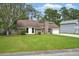 Charming brick home with a well-manicured front yard and driveway showcasing the property's appeal at 106 Ruffin Rd, Summerville, SC 29486