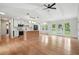 Open concept kitchen with white cabinets, stainless appliances, a kitchen island, and a view to the backyard at 106 Ruffin Rd, Summerville, SC 29486