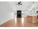 Spacious living room with vaulted ceiling, vinyl floors, fireplace, and ample natural light at 106 Ruffin Rd, Summerville, SC 29486