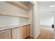 Built-in cabinets with wood shelves and countertop storage space at 106 Ruffin Rd, Summerville, SC 29486