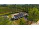 An aerial view of a newly constructed home, featuring a front yard at 117 Dotson St, Harleyville, SC 29448