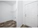 Mud room features built-in white shelving and space for washer/dryer hookups at 117 Dotson St, Harleyville, SC 29448
