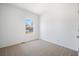 This bedroom features a window allowing for natural light, neutral carpet, and a calming space to promote rest and relaxation at 117 Dotson St, Harleyville, SC 29448