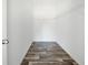 Walk-in closet featuring modern flooring, shelving and a door at 117 Dotson St, Harleyville, SC 29448