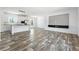 Bright open living area features modern flooring, a stylish media center and abundant natural light at 117 Dotson St, Harleyville, SC 29448