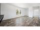 Bright open living area features modern flooring, white walls and abundant natural light at 117 Dotson St, Harleyville, SC 29448