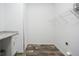 A spacious utility room provides ample counter space, shelving, and storage for laundry and household cleaning supplies at 117 Dotson St, Harleyville, SC 29448