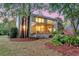 Home featuring a screened porch and fire pit in a lush backyard at 1185 Out Of Bounds Dr, Summerville, SC 29485