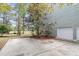Backyard features a large concrete patio and a two-car garage at 1185 Out Of Bounds Dr, Summerville, SC 29485