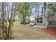 Enjoy a beautiful screened porch and fire pit in this home's backyard at 1185 Out Of Bounds Dr, Summerville, SC 29485