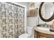Well-lit bathroom with a granite vanity and decorative round mirror at 1185 Out Of Bounds Dr, Summerville, SC 29485