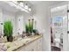 Bright bathroom featuring a granite vanity and a separate toilet room at 1185 Out Of Bounds Dr, Summerville, SC 29485