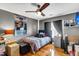 Cozy bedroom featuring a ceiling fan, sleek furniture, and a warm, inviting ambiance at 1185 Out Of Bounds Dr, Summerville, SC 29485