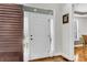 Bright foyer with a white front door, wood floors, and stylish decor at 1185 Out Of Bounds Dr, Summerville, SC 29485