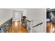 Bright hallway with hardwood floors and decorative railings that provide an open and airy feel at 1185 Out Of Bounds Dr, Summerville, SC 29485