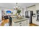 This kitchen features stainless appliances, ample storage, an island and easy access to the living room at 1185 Out Of Bounds Dr, Summerville, SC 29485