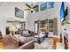 Bright living room boasts high ceilings, natural light, and comfortable seating for relaxation and entertainment at 1185 Out Of Bounds Dr, Summerville, SC 29485
