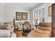 Cozy living room with comfortable seating, hardwood floors, and natural light at 1185 Out Of Bounds Dr, Summerville, SC 29485