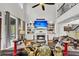 Spacious living room with fireplace, large TV, and staircase access to the second floor at 1185 Out Of Bounds Dr, Summerville, SC 29485