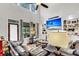 Open living room featuring a fireplace, built-in shelving, and large windows with backyard views at 1185 Out Of Bounds Dr, Summerville, SC 29485