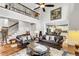 Bright and open living room offers ample seating, a staircase, and a view into the kitchen area at 1185 Out Of Bounds Dr, Summerville, SC 29485