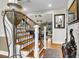 Elegant staircase with wood and iron detailing, leading to the upper level at 1185 Out Of Bounds Dr, Summerville, SC 29485