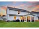 The backyard features a screened-in porch, well-kept lawn, and a home with a modern design at 119 Loon Dr, Summerville, SC 29483