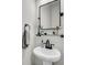 Stylish bathroom with a modern sink, black hardware, and decorative shelving at 119 Loon Dr, Summerville, SC 29483