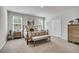 Serene bedroom with a comfortable bed, neutral walls, and coordinating furnishings with natural light at 119 Loon Dr, Summerville, SC 29483