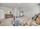 Cozy bedroom featuring a comfortable bed with a patterned quilt, dresser, and a large decorative mirror at 119 Loon Dr, Summerville, SC 29483