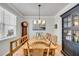 Elegant dining room featuring a large wooden table with chairs and a china cabinet at 119 Loon Dr, Summerville, SC 29483