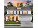 Inviting two-story home with blue shutters, manicured lawn, and a cozy front porch at 119 Loon Dr, Summerville, SC 29483
