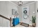 Stylish foyer with a bright-blue cabinet, decor, and a welcoming front door with wreath at 119 Loon Dr, Summerville, SC 29483