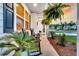 Inviting front porch with comfortable rocking chairs and lush ferns, perfect for relaxing at 119 Loon Dr, Summerville, SC 29483