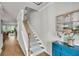 Hallway with hardwood floors, carpet stairs, a wooden banister, and an accent cabinet at 119 Loon Dr, Summerville, SC 29483
