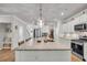 Expansive kitchen island with granite countertops, ample seating, and stylish pendant lighting at 119 Loon Dr, Summerville, SC 29483