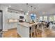 Open-concept kitchen with white cabinets, granite countertops, and a central island with seating at 119 Loon Dr, Summerville, SC 29483