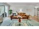 Comfortable living room featuring a brown leather couch and glass coffee table at 119 Loon Dr, Summerville, SC 29483